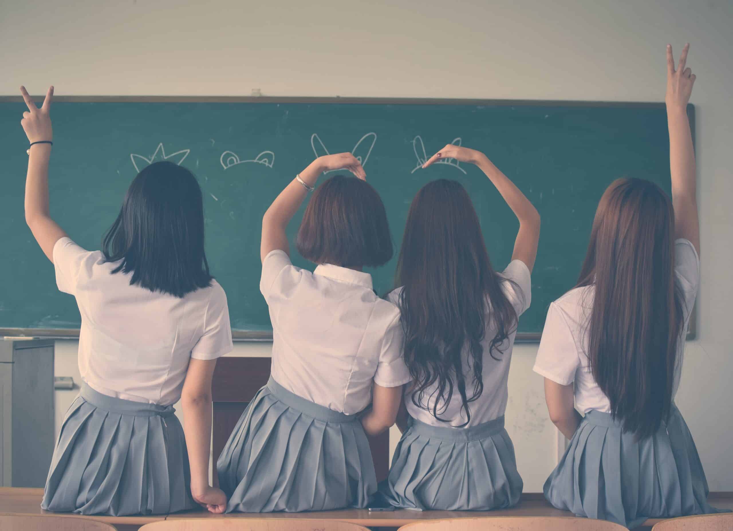 Image of girl children with smooth shiny hair in class room
