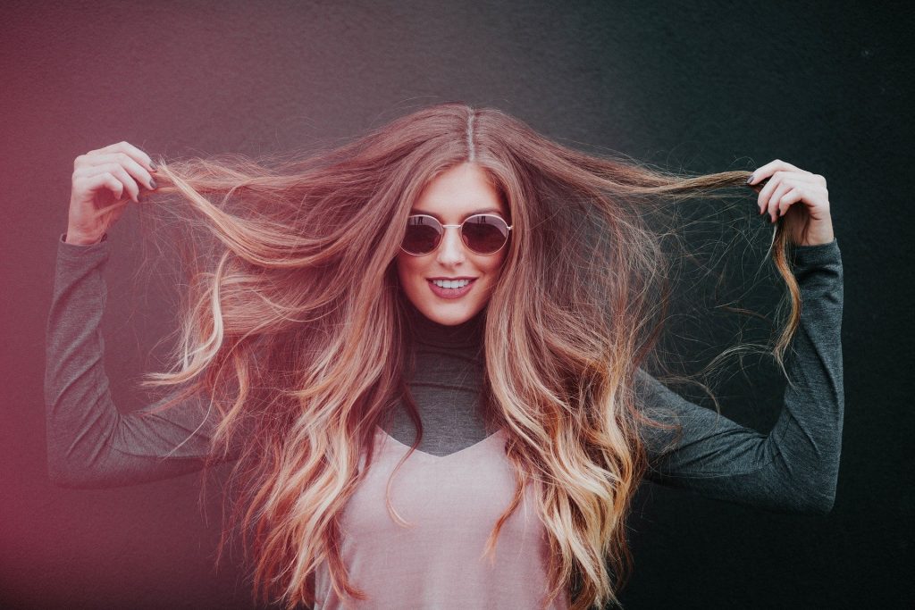 Image of a girl with long hair as if it needs a hair dryer to fix