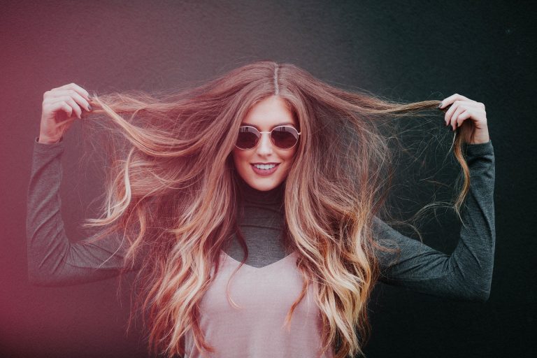 Image of a girl with long hair as if it needs a hair dryer to fix