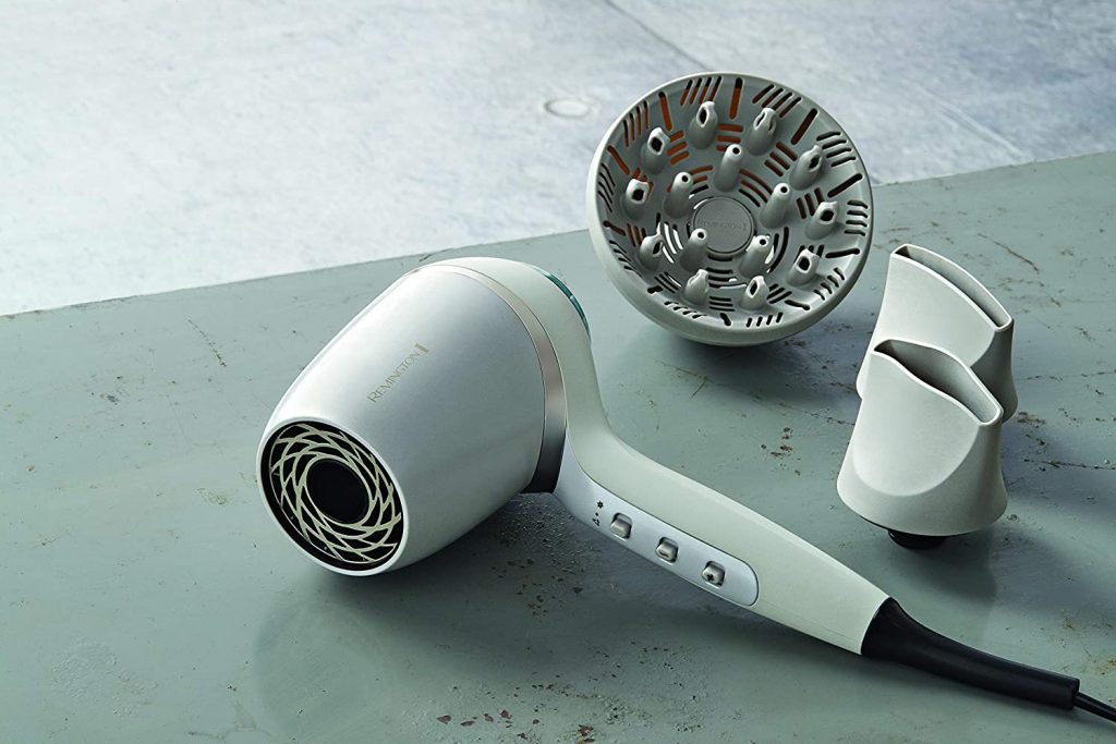 Image off the white Remington Hydraluxe Pro Hair Dryer and its included diffuser and 2 nozzles